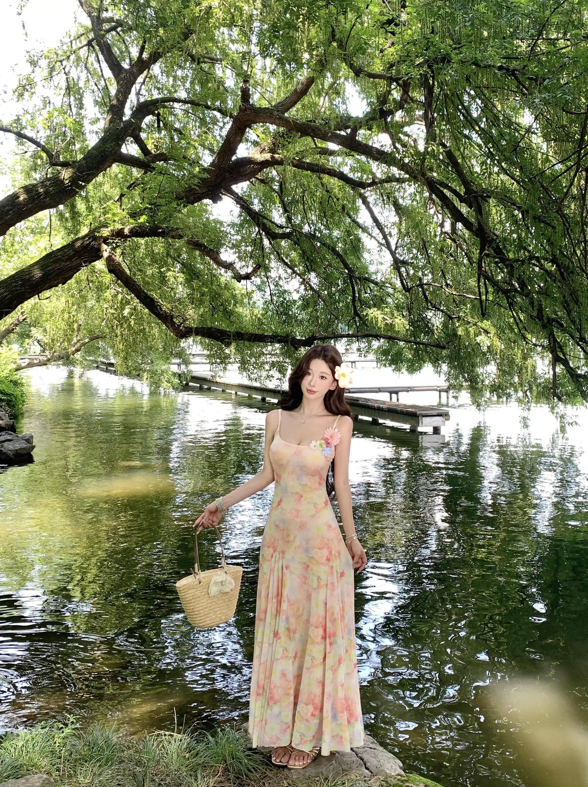 A stunning dress perfect for summer island photography, with a vacation style, sweet spaghetti straps, a fitted waist, suitable