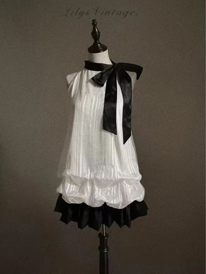 Vintage-Inspired Halter Babydoll Dress Bow Accent Flared Hem Classic Heiress Style Fit and Flare Dress