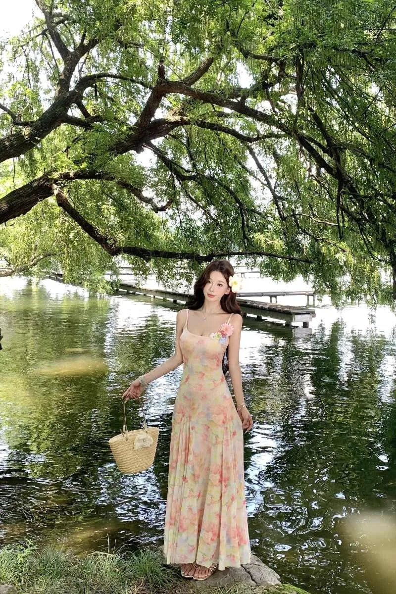 A stunning dress perfect for summer island photography, with a vacation style, sweet spaghetti straps, a fitted waist, suitable
