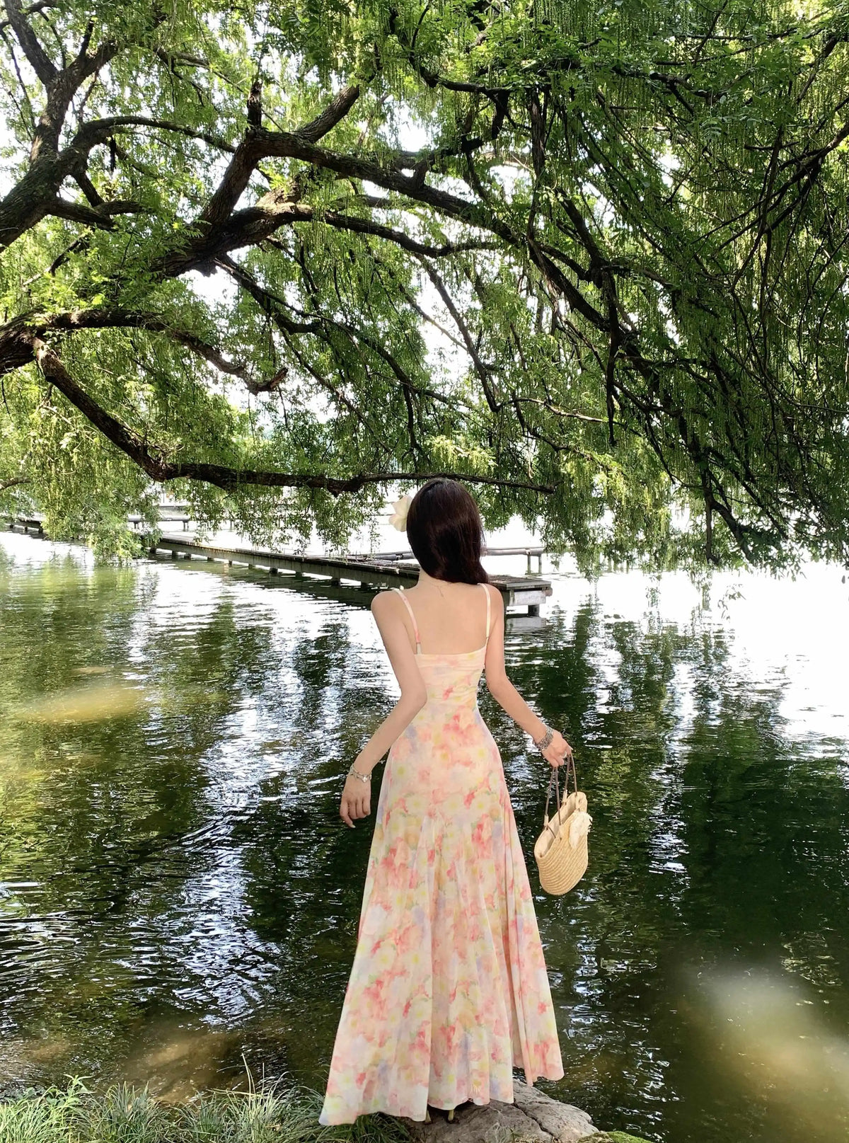 A stunning dress perfect for summer island photography, with a vacation style, sweet spaghetti straps, a fitted waist, suitable