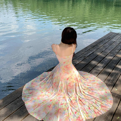 A stunning dress perfect for summer island photography, with a vacation style, sweet spaghetti straps, a fitted waist, suitable