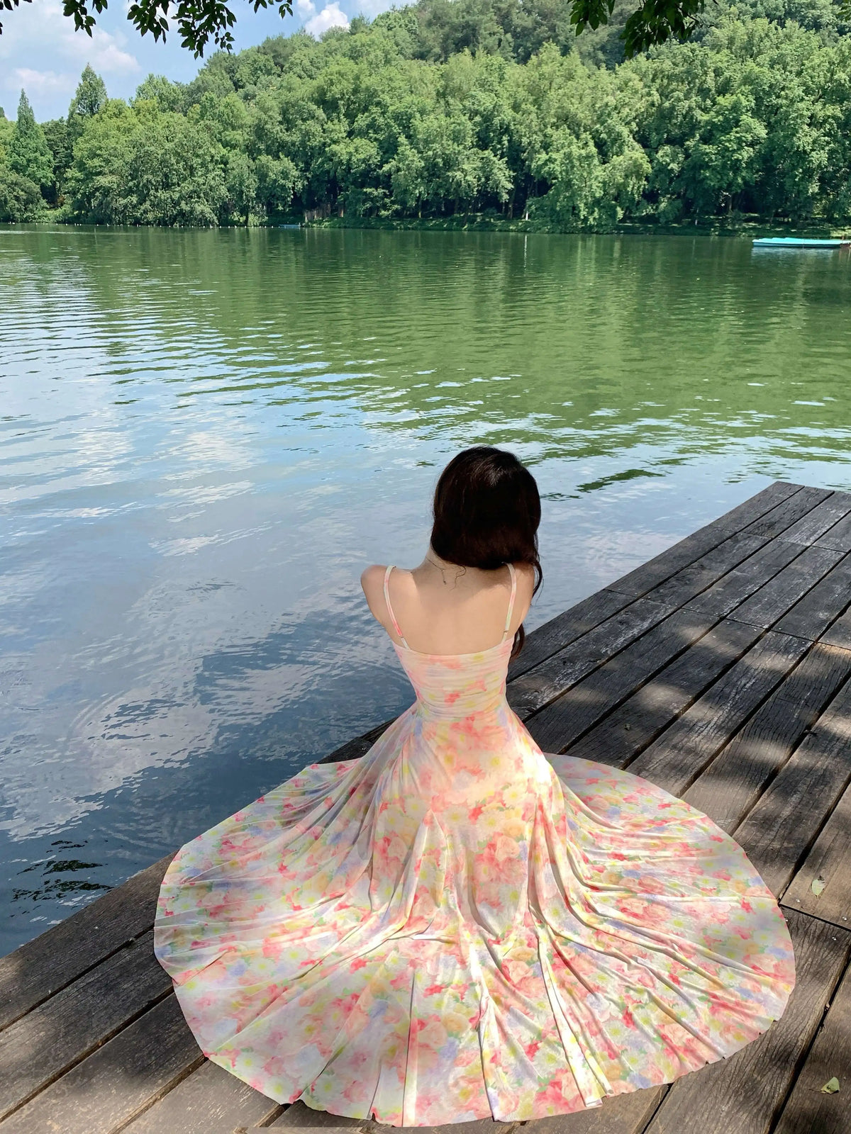 A stunning dress perfect for summer island photography, with a vacation style, sweet spaghetti straps, a fitted waist, suitable