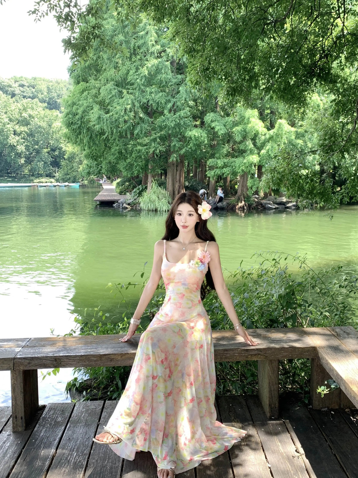 A stunning dress perfect for summer island photography, with a vacation style, sweet spaghetti straps, a fitted waist, suitable