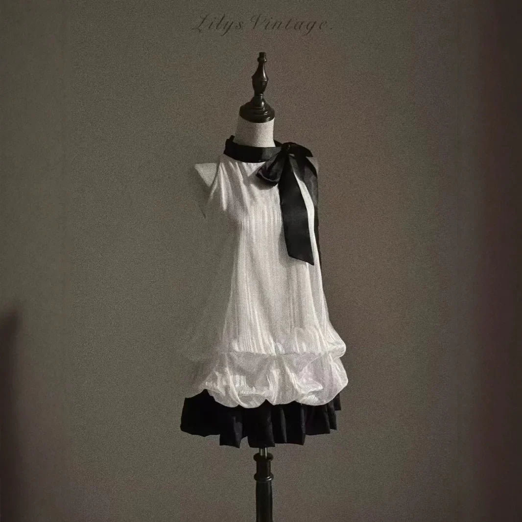 Vintage-Inspired Halter Babydoll Dress Bow Accent Flared Hem Classic Heiress Style Fit and Flare Dress