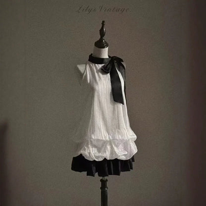 Vintage-Inspired Halter Babydoll Dress Bow Accent Flared Hem Classic Heiress Style Fit and Flare Dress