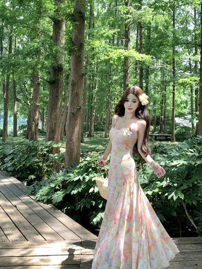 A stunning dress perfect for summer island photography, with a vacation style, sweet spaghetti straps, a fitted waist, suitable