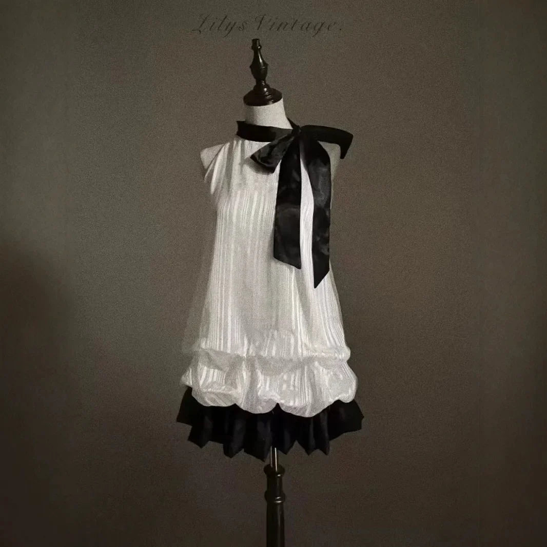 Vintage-Inspired Halter Babydoll Dress Bow Accent Flared Hem Classic Heiress Style Fit and Flare Dress