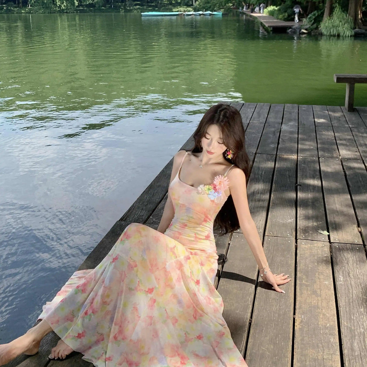 A stunning dress perfect for summer island photography, with a vacation style, sweet spaghetti straps, a fitted waist, suitable