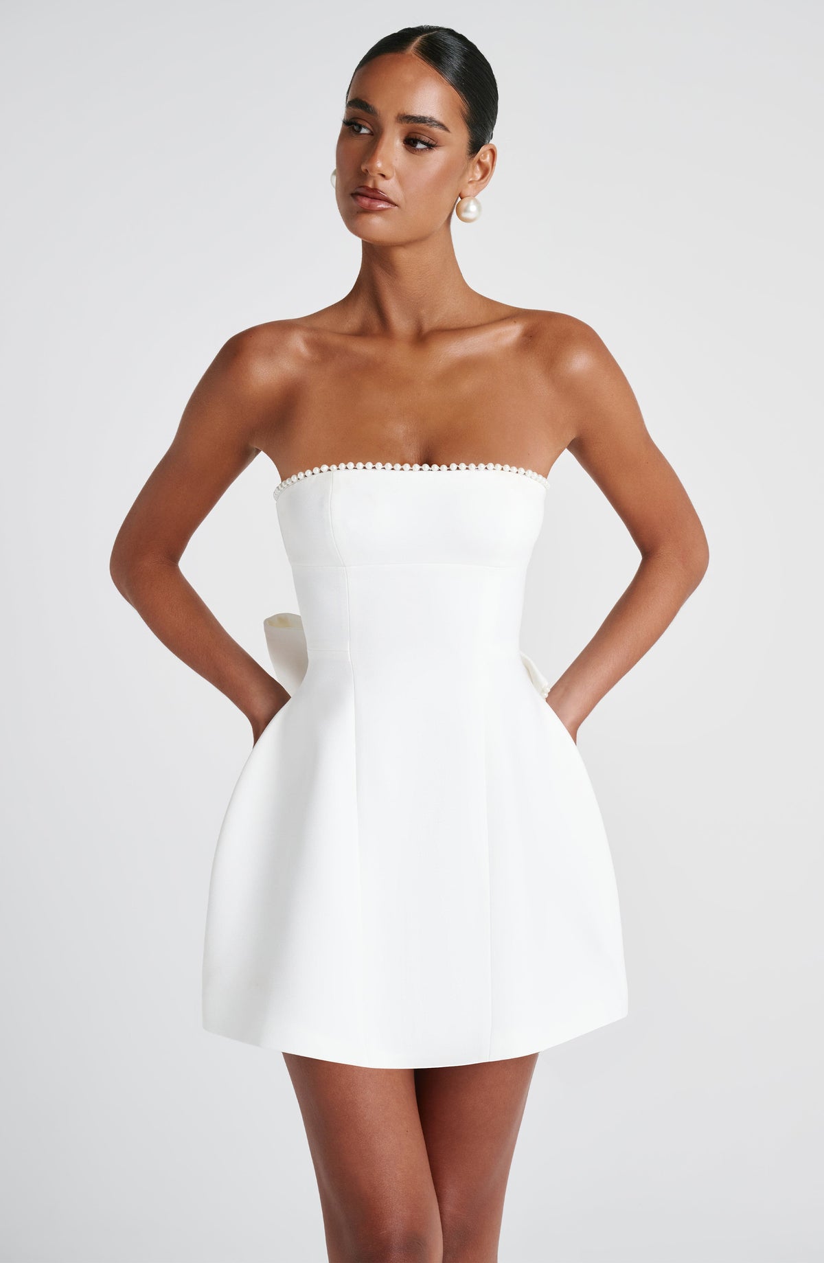 Pearl Trim Strapless Paneled Bow Back A-Line Mini Dress