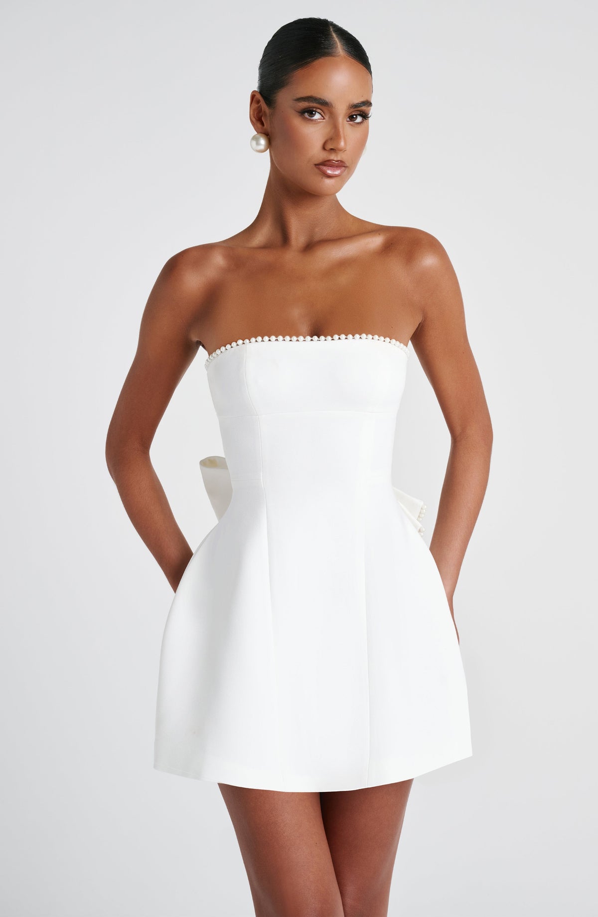 Pearl Trim Strapless Paneled Bow Back A-Line Mini Dress