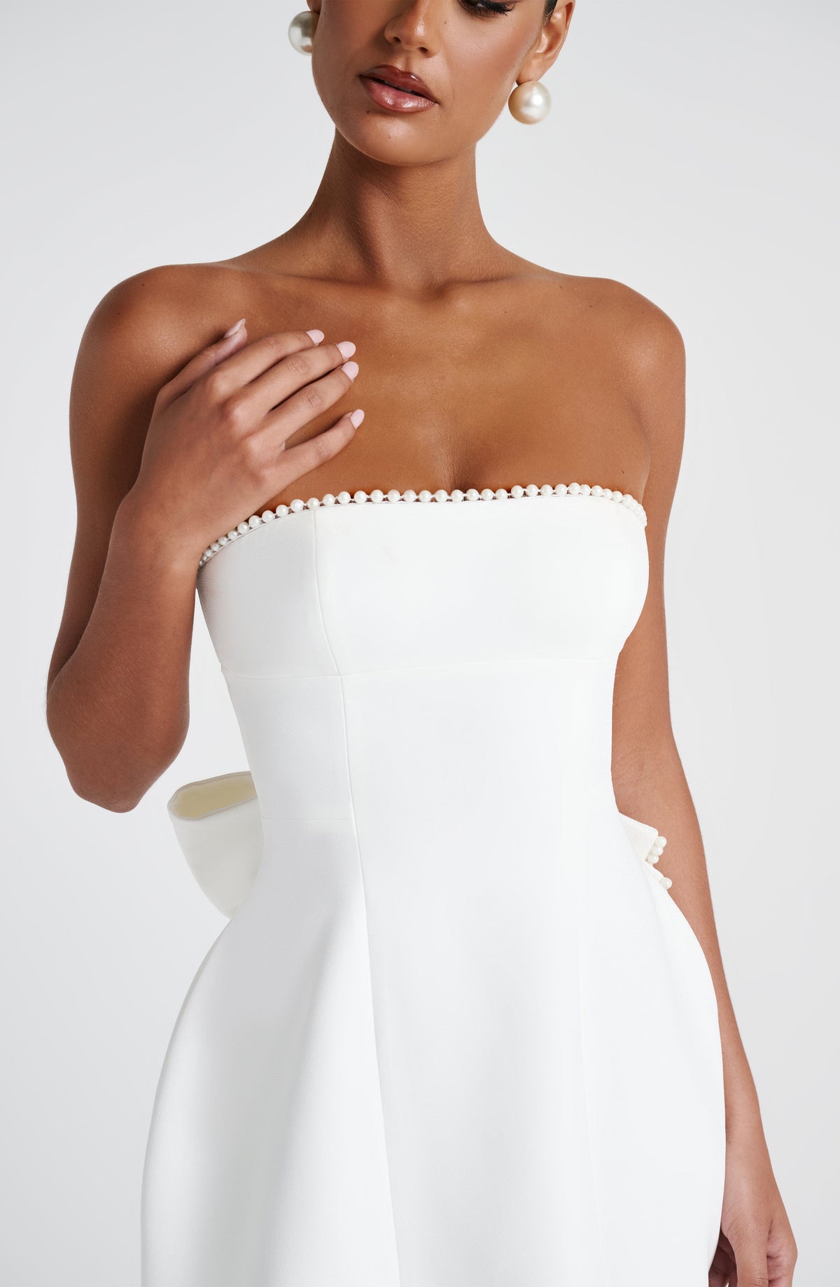 Pearl Trim Strapless Paneled Bow Back A-Line Mini Dress