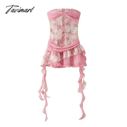 The women ensemble consists of a vibrant pink floral patchwork bustier dress, paired with a summery flutter skirt, creating 2024